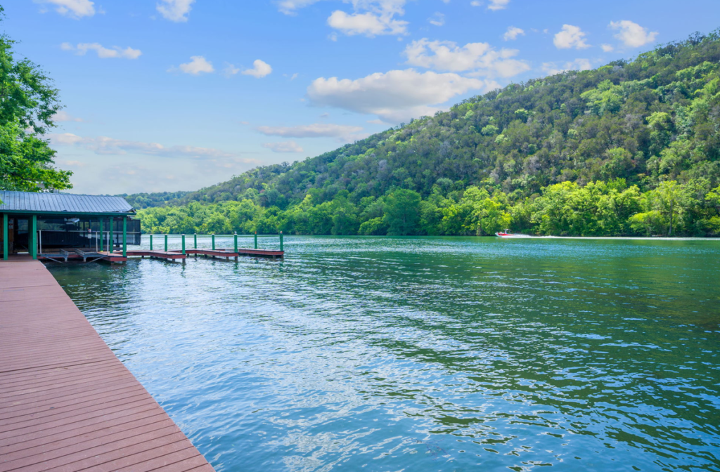 Dock house and ski boat on Lake Austin near Steiner Ranch
